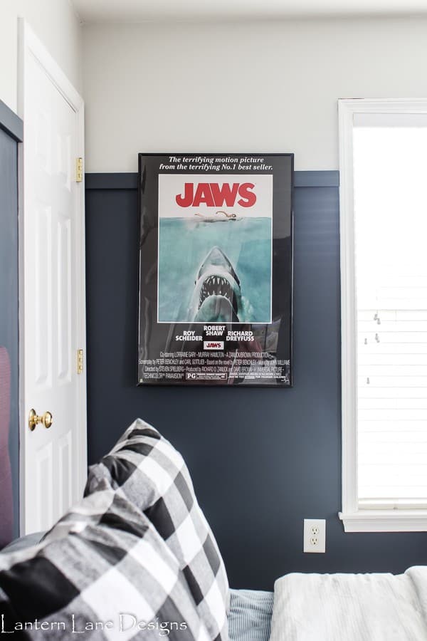 Boys room with Jaws sign and grey upper wall