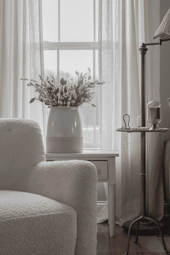 living room with chair and florals in a vase