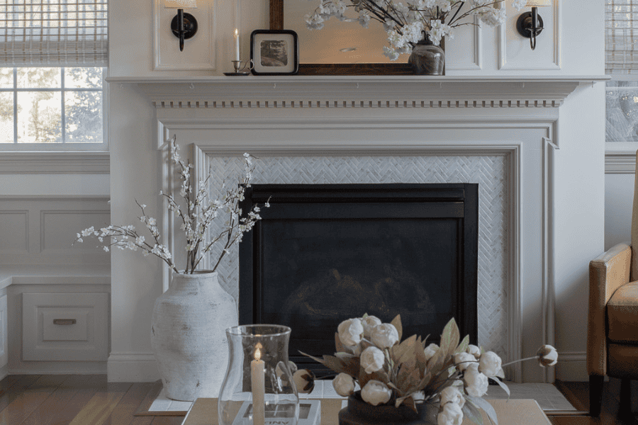 fireplace with planter and flowers