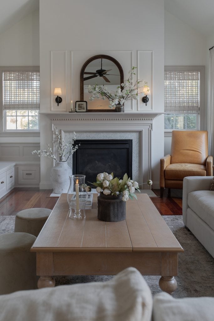 family room with mirror on mantel